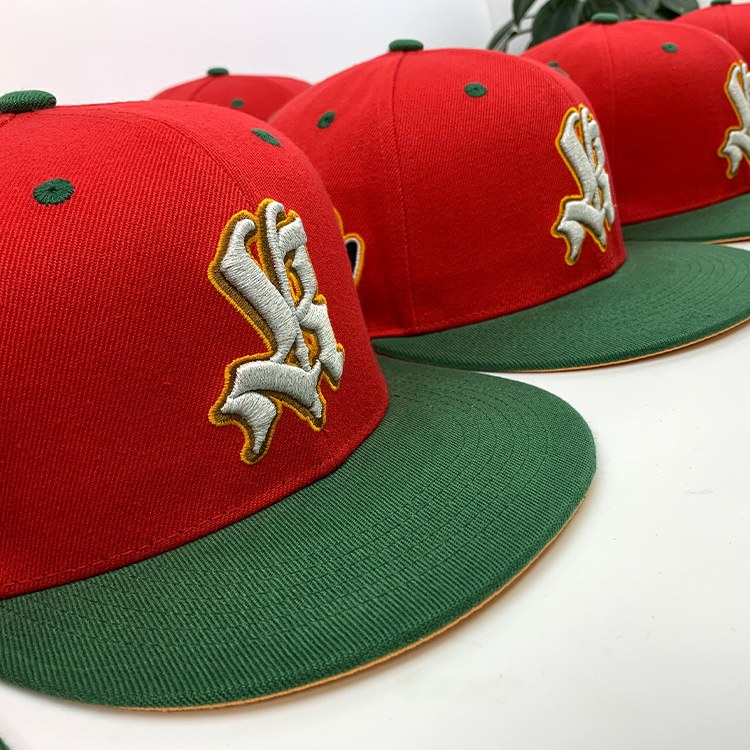 Red and green custom snapbacks with 3D puff embroidery